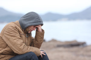 teen male in hoodie depressed