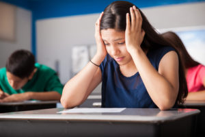 girl looks stressed in school