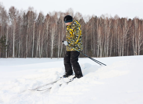 boy cross country skiing in winter