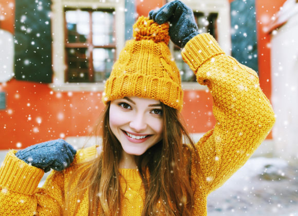 girl in winter attire in snow