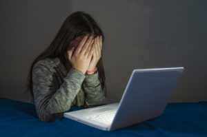 girl being cyber bullied