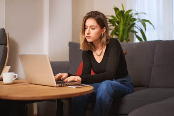 young woman in online therapy session