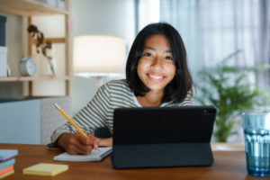 a young female student participating in youth counselling online 